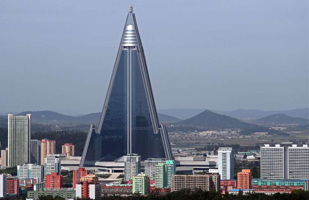 Ryugyong Hotel at night showing the massive LED display system illuminating Pyongyang's skyline