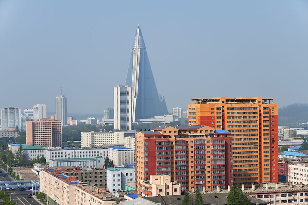 Daytime view of the Ryugyong Hotel showing the distinctive three-wing triangular pyramid design rising above Pyongyang